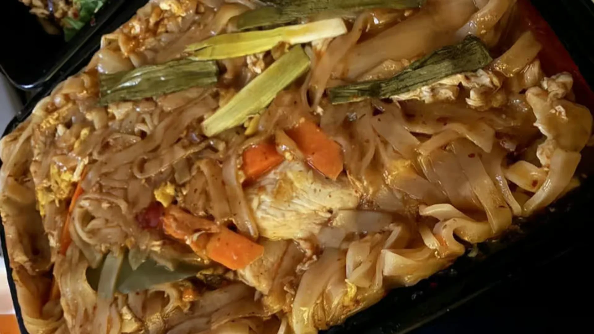 Pad Thai - Classic stir-fried rice noodles with bean sprouts, peanuts, lime, and your choice of protein