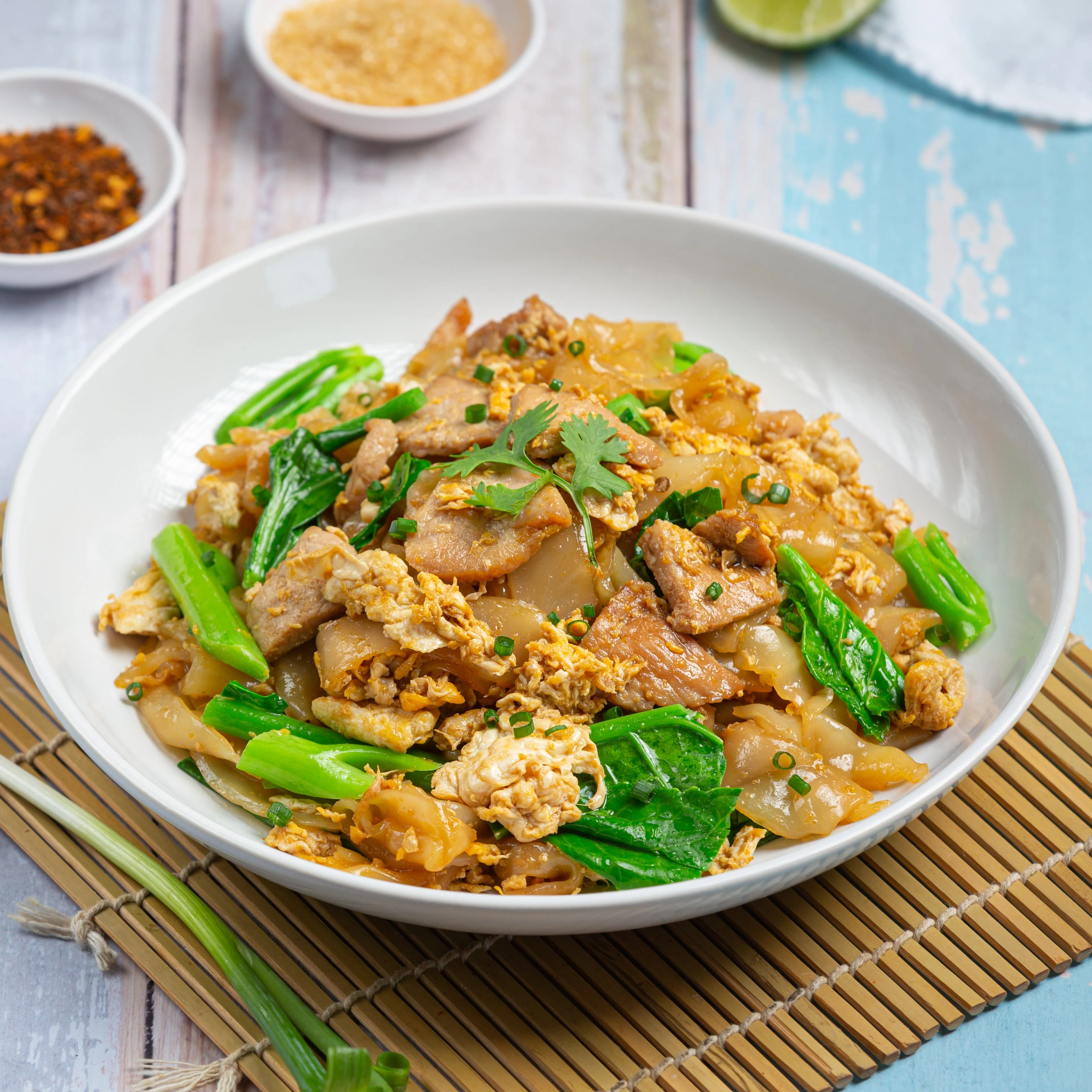 Pad See Ew - Stir-fried wide noodles with egg and Chinese broccoli