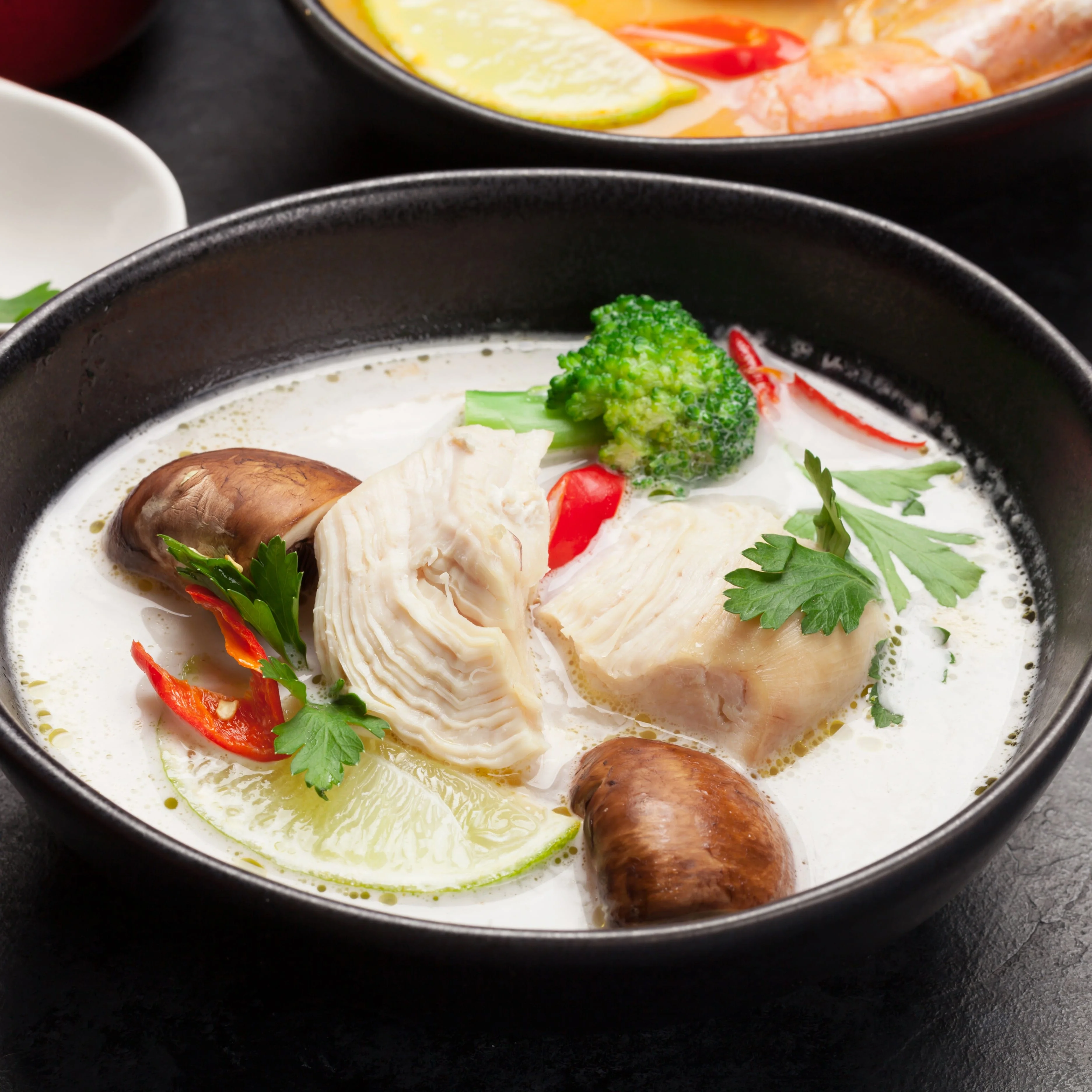 Tom Kha Soup - Coconut milk soup with mushrooms, chili, and lime